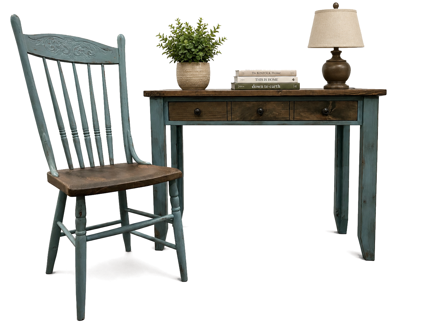Reimagined desk and chair with lamp, books, and a potted plant